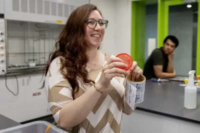 They are jumping for joy. Women’s varsity rowing teammates Oli Seline ’24 (left) of Delaware, Ohio, and Olivia Dekker ’24 of Bethesda, Md., high five it at the conclusion of their last-ever Bates lab in Bonney 360. The teammates are students in Assistant Professor of Biochemistry Geneva Laurita’s Short Term course, “Chemistry and the Arts.” Seline is a biochemistry major with a GEC in “Visible Ideas,” while Dekker is a biochemistry major with a minor in art and visual culture. The course explores the connection between chemistry and various topics in the arts and arts-related fields. The students learn about the chemistry behind these topics, exploring the literature behind various artistic practices, and applying hands-on techniques in the laboratory involved in various art processes This year, Laurita asked students to focus on the origins of color, different crafts, print making, jewelry making, dyeing, and art conservation. Laurita is the recipient of a major National Science Foundation grant of $581,984. The NSF CAREER award, considered to be one of the foundation’s most prestigious awards for faculty members who are just beginning their teaching and research careers, is based on both her scientific research in solid state materials and how she brings undergraduates into that vital area of scientific exploration. 3:18 What the particular lab was about...the lab handout. Kate Baumler, intern for Geneva’s NSF grant, wearing, black shirt Benji Richards, ’27, wearing tan shirt Finian Gunny ’27, gray pullover and blond hair Charlotte Maffie ’25 with pink tie dyed and hair in bun Sister Alice Maffie ’27 in t-shirt and pony tail Nina Greeley ’24 with hair in bun and pink t-shirt Riley Lund ’26 in gray sweatshirt Jahan Baker-Wainwright ’25 in green golf Rohini Kandasamy ’27 in dark tan Life is cool t-shirt and low bun Chemistry and the Arts S28, the origin of different crafts, print making, jewelry making, dyeing and art soncserv