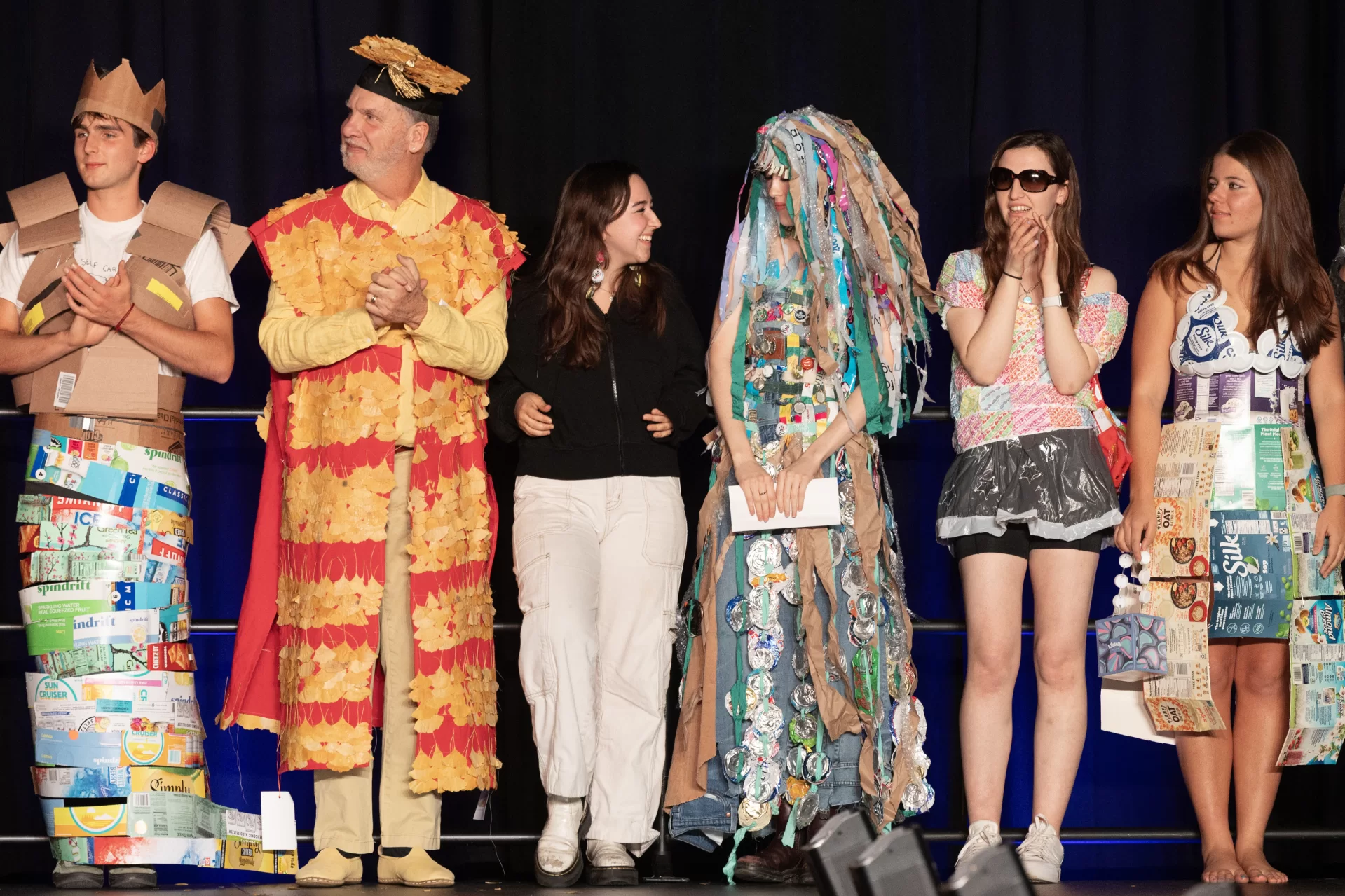 The models and designers stand together