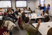 Two first-year seminar classes join together for a dynamic, interdisciplinary final class session During the last week of courses for the fall semester, two instructors, two classes, and one rabbit gathered together for an interdisciplinary, interactive first-year seminar class session. It was easy to tell who was from which course. Students from “Beyond the Rainbow: Exploring the Language (and the Science, Art, and Culture) of Color” had all walked in sporting colorful hats. Joining them in a classroom in Dana Hall were students from “Sex in the Brain: The Neuroscience of Sex, Gender, and Hormones.” While it is typical for students to grow close in these small — 16 students maximum — seminars, this merging of the courses for a class session was a new idea, meant to create new connections between both the subjects and students as the semester came to a close. Lindsey Hamilton ’05, director of the Center for Inclusive Teaching and Learning, and Wells Castonguay, the center’s assistant director, devised the plan. Castonguay was teaching “Beyond the Rainbow” and Hamilton “Sex in the Brain.” Throughout the semester, each professor had heard students’ ongoing curiosity about the other’s course and saw an opportunity for the students to learn from each other.