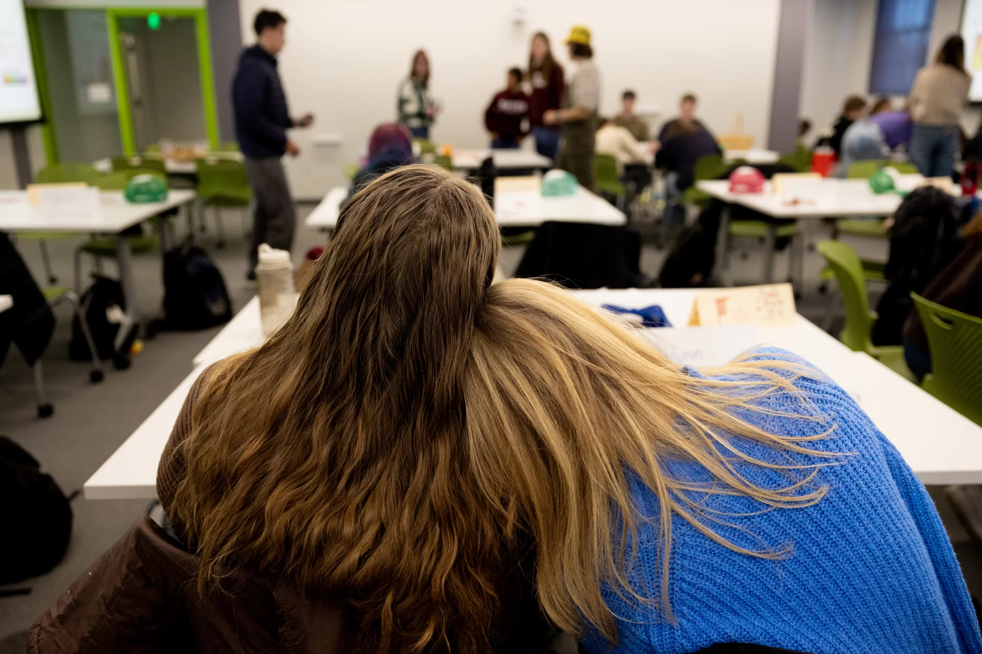 Two first-year seminar classes join together for a dynamic, interdisciplinary final class session During the last week of courses for the fall semester, two instructors, two classes, and one rabbit gathered together for an interdisciplinary, interactive first-year seminar class session. It was easy to tell who was from which course. Students from “Beyond the Rainbow: Exploring the Language (and the Science, Art, and Culture) of Color” had all walked in sporting colorful hats. Joining them in a classroom in Dana Hall were students from “Sex in the Brain: The Neuroscience of Sex, Gender, and Hormones.” While it is typical for students to grow close in these small — 16 students maximum — seminars, this merging of the courses for a class session was a new idea, meant to create new connections between both the subjects and students as the semester came to a close. Lindsey Hamilton ’05, director of the Center for Inclusive Teaching and Learning, and Wells Castonguay, the center’s assistant director, devised the plan. Castonguay was teaching “Beyond the Rainbow” and Hamilton “Sex in the Brain.” Throughout the semester, each professor had heard students’ ongoing curiosity about the other’s course and saw an opportunity for the students to learn from each other.