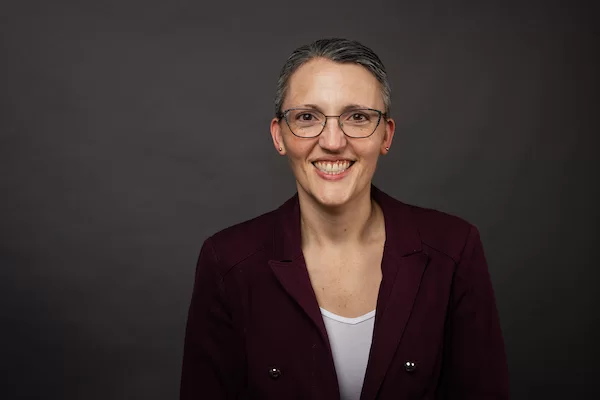 A woman poses for a portrait.
