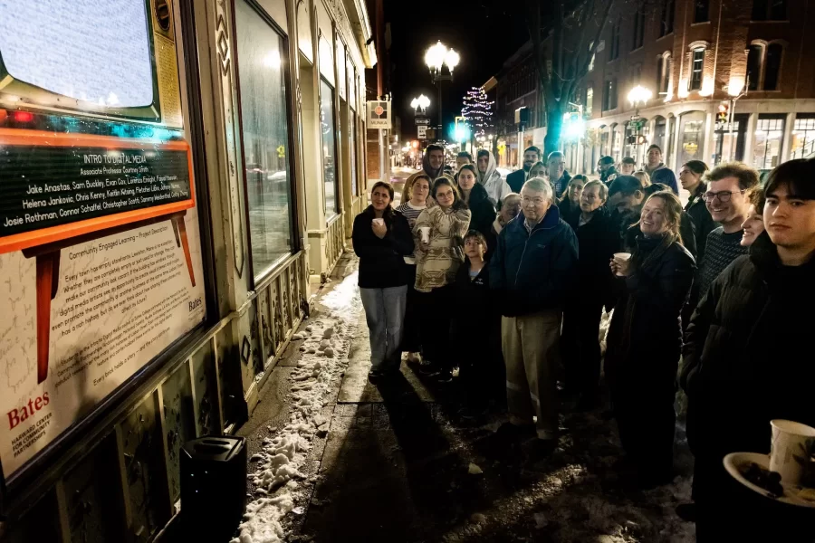 On a chilly night in December, students from Associate Professor of Theater Courtney Smith’s  Introduction to Digital Media course presented their final project on Lisbon Street, the heart of Lewiston's historic downtown, and the subject of this interdiscliplinary course (cross listed between theater and digital and computational studies). For their work in this community engaged learning experience, they explored resources that included the Muskie Archives on campus and the Androscoggin Historical Society, to create a multimedia portrait of Lisbon Street, dating back to the days of electric trolley cars. In attendance at the big reveal included Professor Emeritus Doug Hodgkin, Lewiston Mayor Carl Sheline, and Darby Ray, who collaborated with Smith. (Phyllis Graber Jensen/Bates College)
