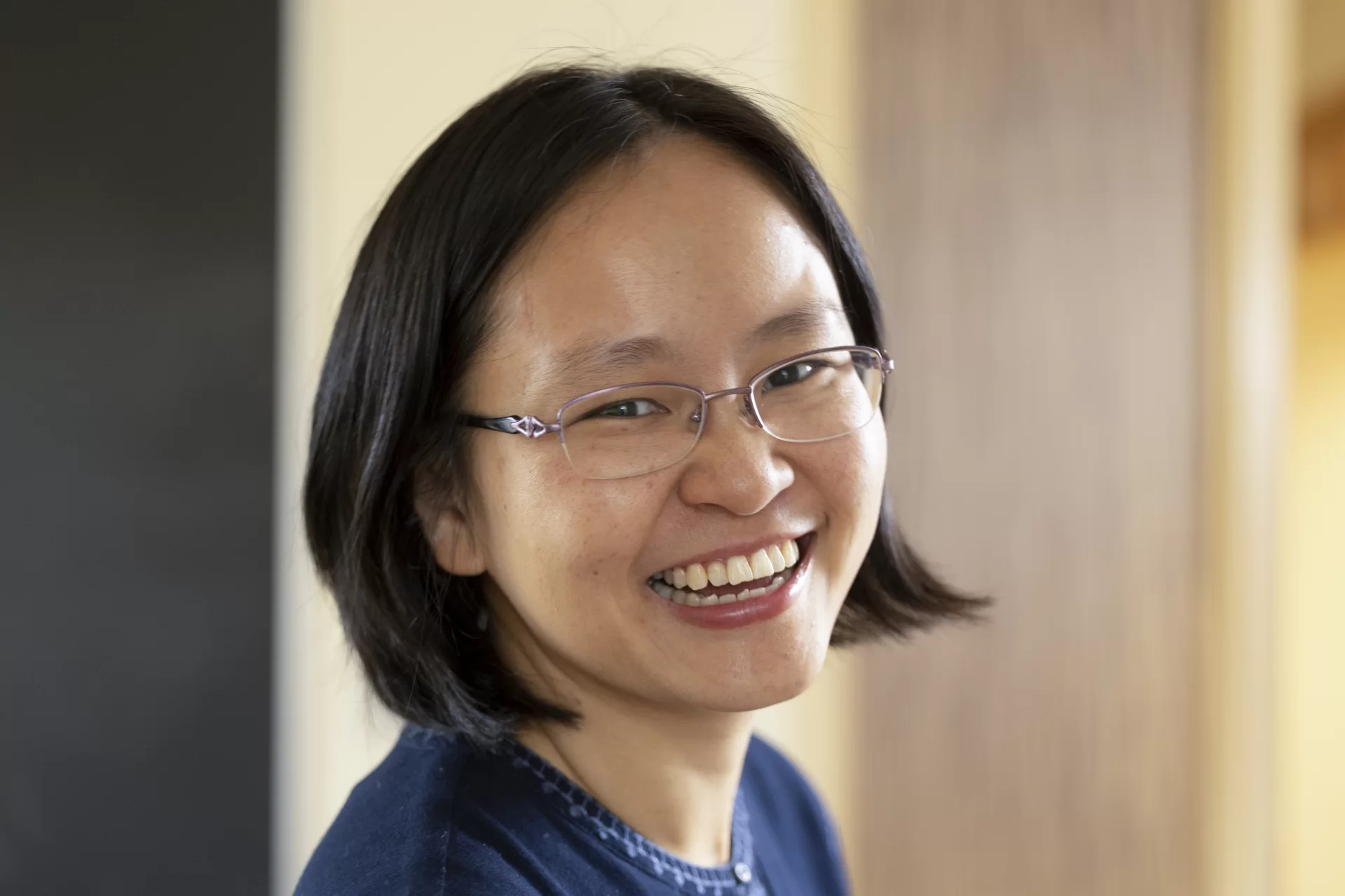 Assistant Professor of Chinese Zhenzhen Lu poses in her Roger Williams, Room 205, office.