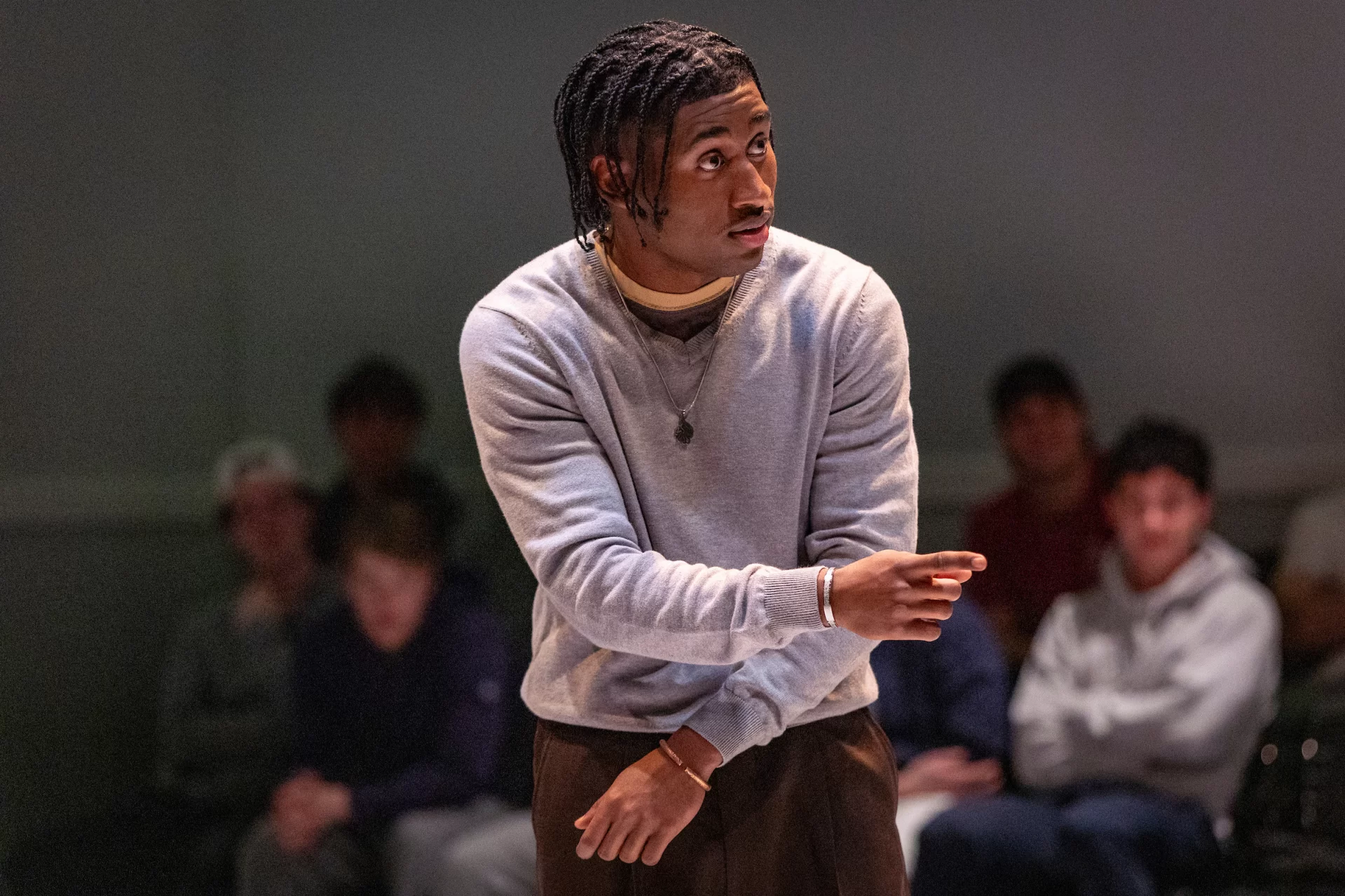 A man points onstage.