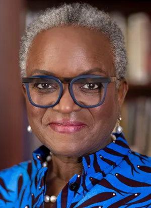 A portrait of a woman with glasses