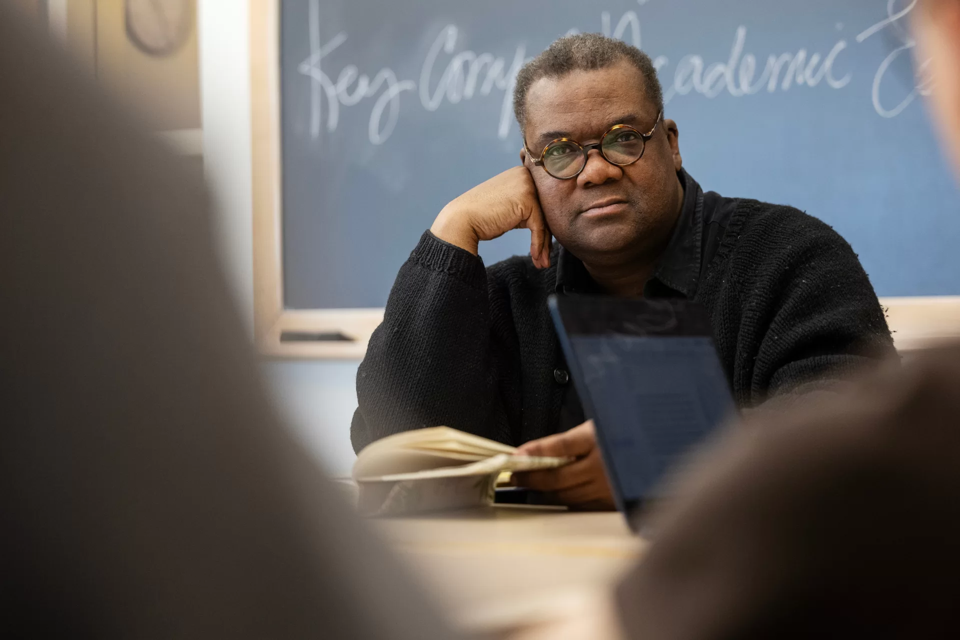 Moments from inside Myron Beasley's course Intro to AMST in the AMST Lounge in Pettengill Hall on March 23rd, 2026. (Theophil Syslo | Bates College)
Myron Beasley, Ph.D. is Associate Professor of American Studies, he also serves on the committee of Gender and Sexuality Studies at Bates College. His ethnographic research includes exploring the intersection of cultural politics, material culture and social change. He has been awarded fellowships and grants by the Andy Warhol Foundation, the Whiting Foundation, the Mellon Foundation, National Endowment for the Humanities, and most recently the Ruth Landes Award from the Reed Foundation. His ethnographic writing about Africana Cultural Politics, Contemporary Art, Material Culture and cultural engagement has appeared in many academic journals including Text and Performance Quarterly, Gastronomica: The Journal of Food and Culture, The Journal of Poverty, Museum & Social Issues, The Journal of Curatorial Studies, Food and Foodways, and Performance Research. His food film/installation ritual/feast (of his ethnography is Brazil) has appeared in UMMI and Paris film festivals. His recent curatorial projects include The Ghetto Biennale (Haiti), CAAR Paris 7 (France), and Dak’art (Senegal).