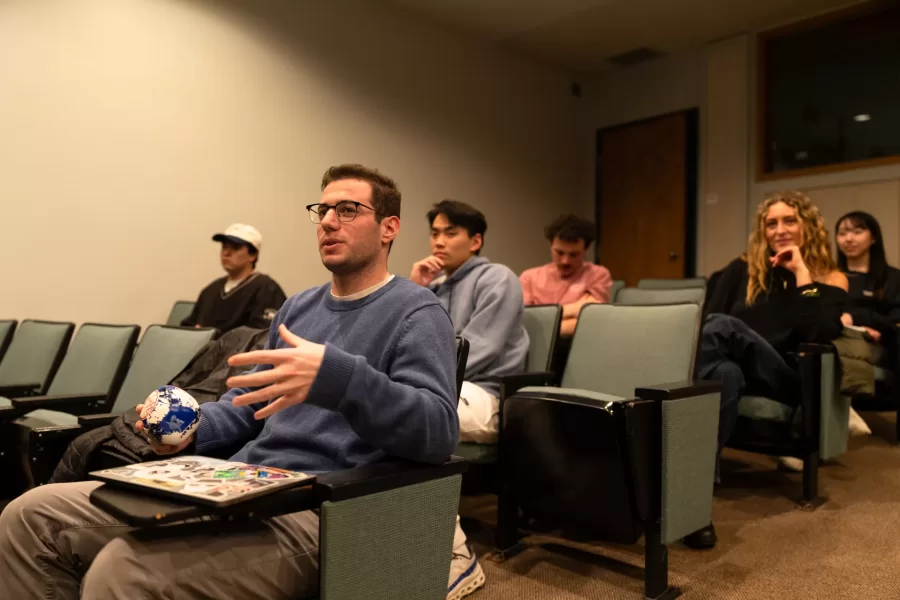 Lewiston, ME, United States  -- Students discuss whether they should show the film, “Say Cheese!” by Bates alum Amy Geller `96, during a Film Festival Studies taught by Professor Jonathan J. Cavallero in Olin Arts Center 105 at Bates College in Lewiston, ME on Wednesday, March 25, 2026. Students discussed whether they should show the film at the upcoming festival and whether the festival should help fund an original score for the film due to copyright issues with the music currently being used in it. (Photo by Yoon S. Byun) © 2026 Strewn Wonder, LLC
