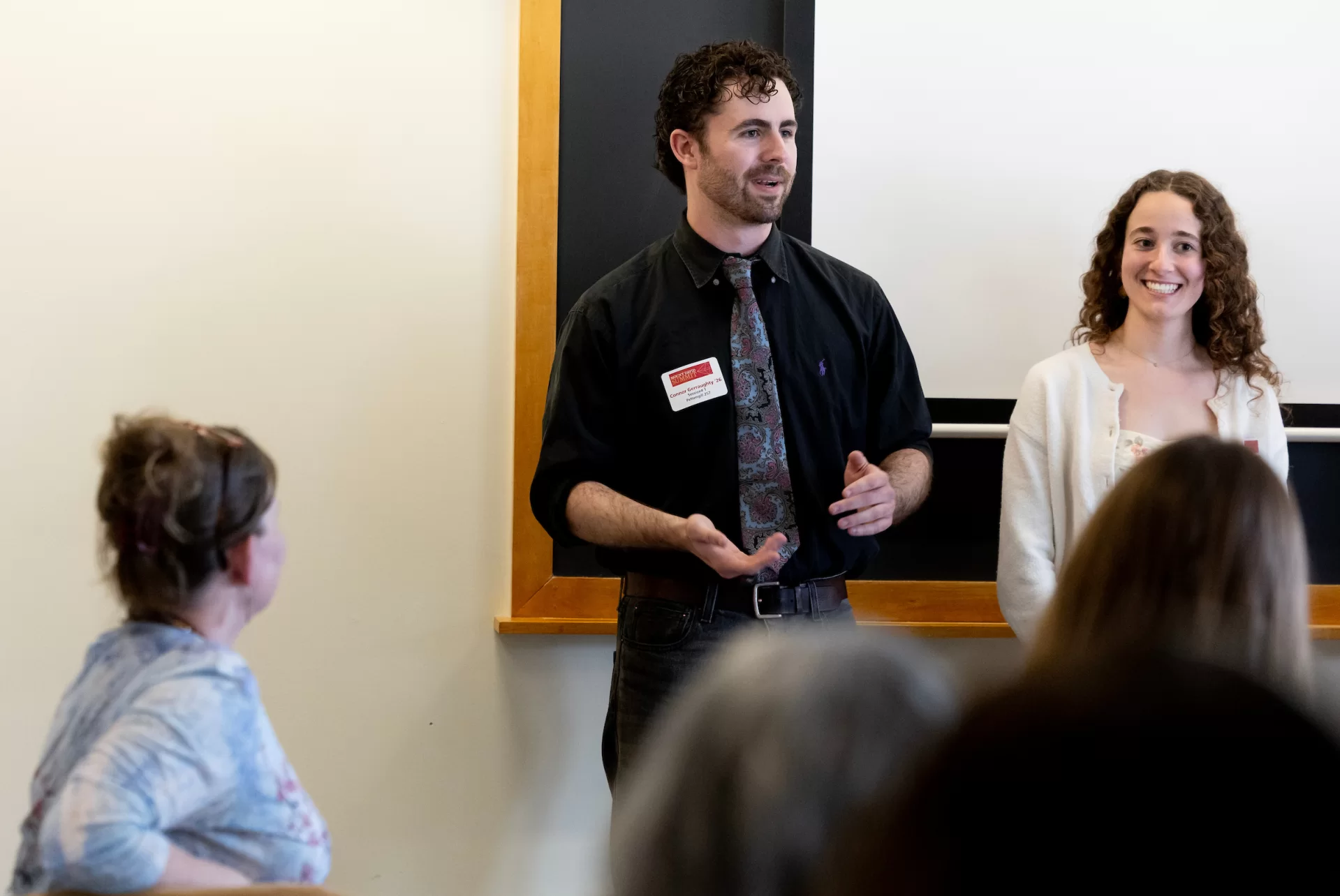 A man gives a presentation in a classroom.