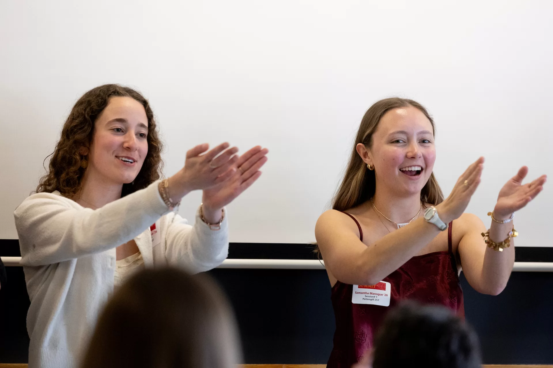 Two women cheering.