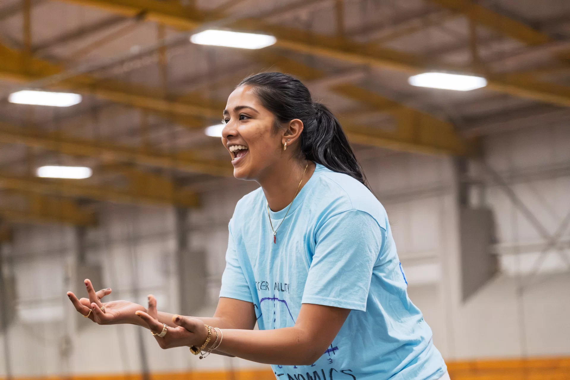 A woman smiling on a court.