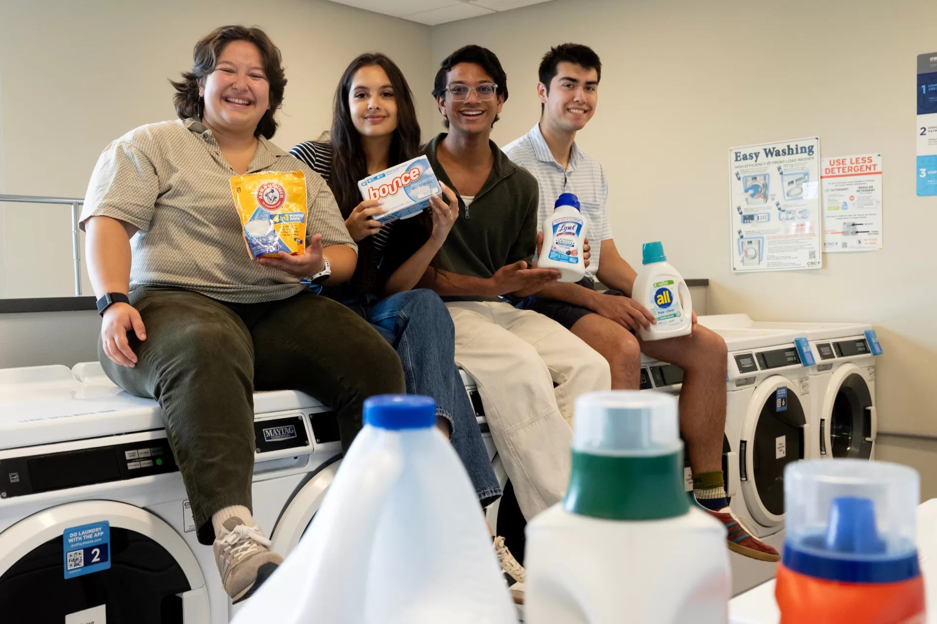 Students who were involved in securing free laundry washing for all Bates students, posing in the laundry room in Chu Hall on May 27, 2026.

Aleisha Martinez Sandoval ’26 of Mexico City, Trinity Monstwillo ’26 of Corvallis, Ore., Mohammad Zayd ;27 of the Bronx, N.Y., and Zachariah Richards ’26 of Princeton, Mass.