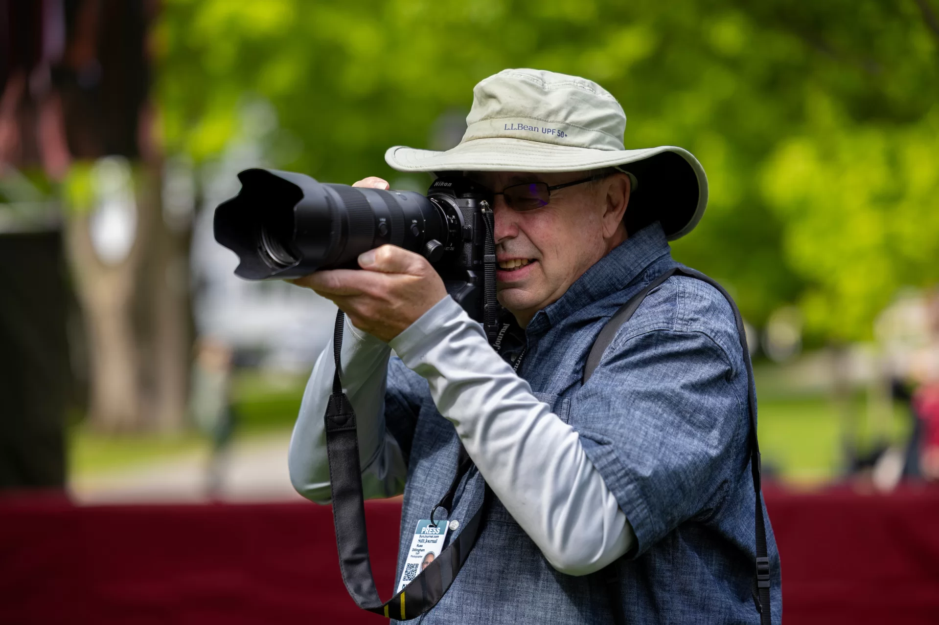 Sun Journal photographer Russ Dillingham, who grew up next door to Bates, photographs Commencement on May 31, 2026. A Bates graduation is “relaxed, friendly, and joyful,” he says. (Phyllis Graber Jensen/Bates College)