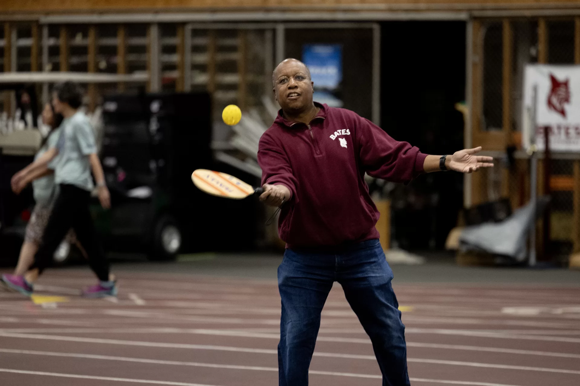 A man playing pickleball