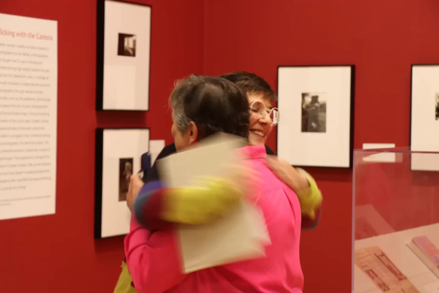 Graber Jensen hugging Carrie Cushman at museum
