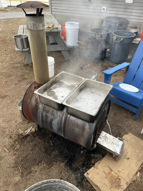 An evaporator boiling maple sap into syrup