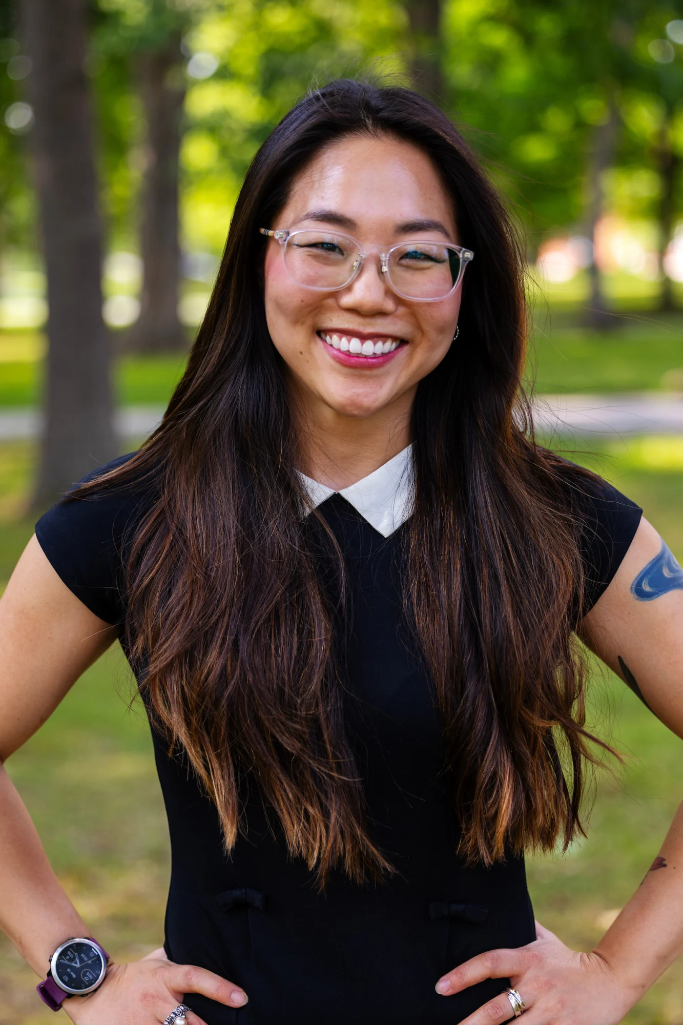 A woman smiling outside