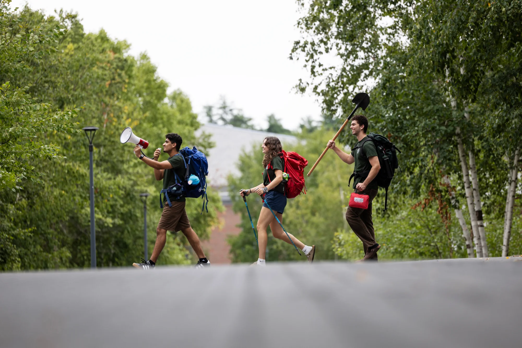 AESOP coordinators Carly Buck ’27, of Arlington, Mass., Zain Ali ’ 27, of Lebanon, Ohio, and Alexander Voglmayr ’27, of Washington D.C., pose for some portraits on August 17, 2026. (Theophil Syslo | Bates College)