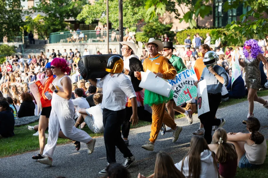 In an annual rite of passage the @batesaesop leaders get the classic dousing of – shall we call it AESOP slop? – before welcoming the Class of 2030 to the AESOP portion of their orientation. Captured on August 28, 2026. (Theophil Syslo | Bates College)