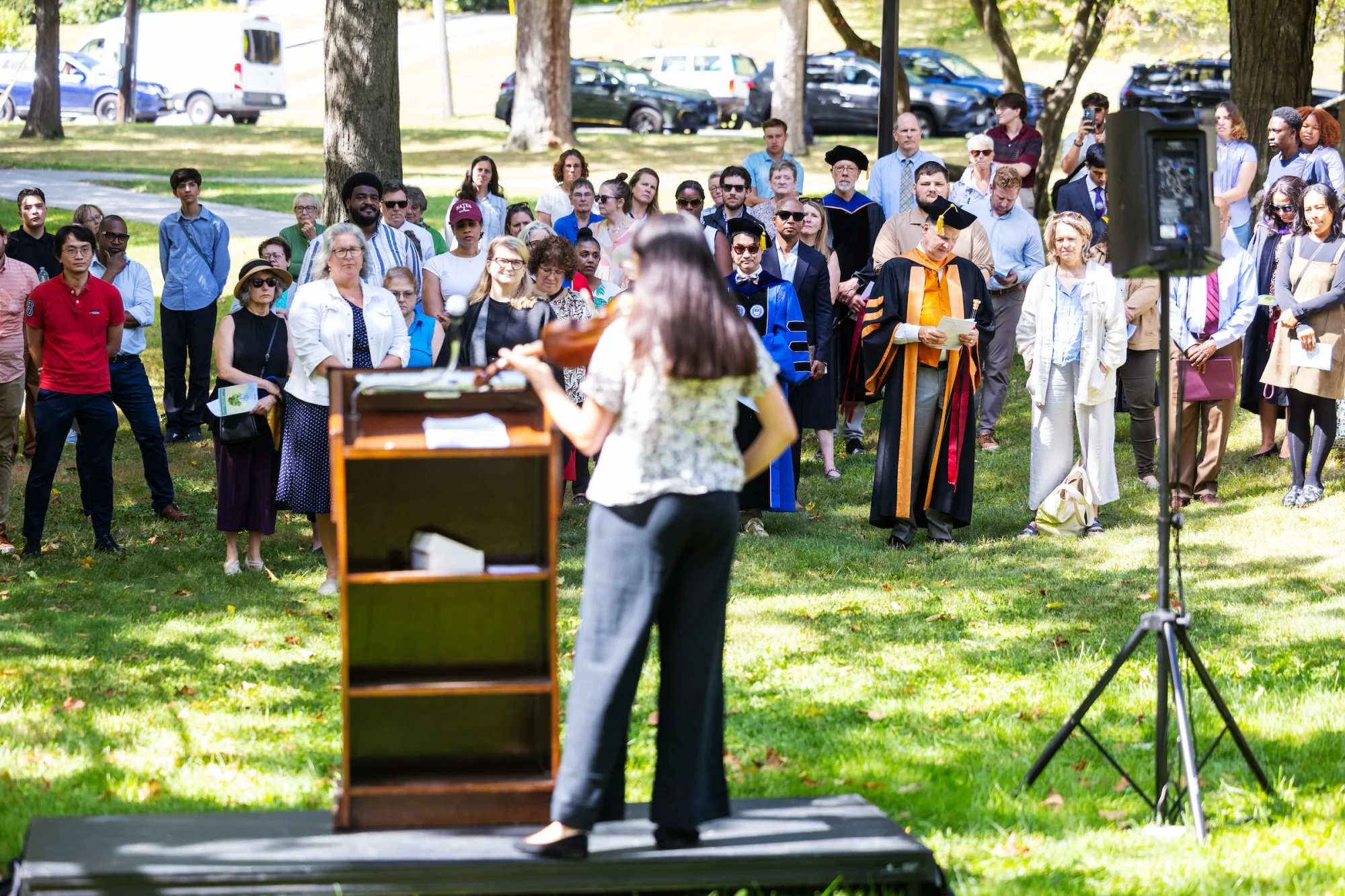 student playing music at tree planting
