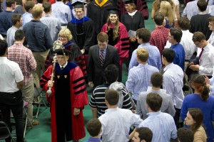As ever, mace bearer and Professor of Sociology Sawyer Sylvester leads the Convocation procession. (Michael Bradley/Bates College)