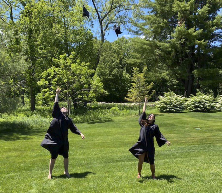 Commencement Day scenes on May 31, 2020:Cousins Patrick Crowley '20 of Lexington, Mass., and Callie Abouzeid '20 of Belmont, Mass., toss their graduation caps in unison.