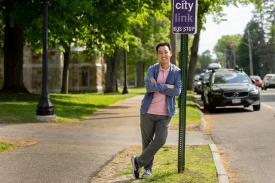 APPROVED, Alan Wang ’24 on College Street in front to Parker Hall where covered bus stop will be built on lawn behind him. 11/13/2023 16:25:54 Transportation for Bates awang3@bates.edu 5075817683 Student Better Bus Stop for Bates The MaineDOT is planning on implementing a commuter bus line between Lewiston and Portland. The bus line is set to terminate at Bates near Underhill Arena. However, the bus stop might not be pleasant and intuitive to use. Study from University of Minnesota show that bus stop amenities have a direct relationship with rider's perceived waiting time; having a bench can reduce the perceived waiting time by half compared to a stop without a bench. A well-equipped bus stop can entice more people to use it, thus reducing Bates' carbon footprint. "A bus shelter costs around $5,500. I want to apply for the full $2,000 grant to ultimately put this money back in the school's pocket, in the form of a well-designed bus shelter. This green fund can be a part of a larger funding package, I'm assuming that MaineDOT and the operator of this bus line will both pitch in to fund this shelter. The bus shelter should protect riders from weather elements, display proper signage and maps, equip with lighting and seating. MaineDOT also recommends installing bike racks and trash cans. The green grant can be used to achieve aspect(s) of the above objectives. " Increase comfort level when using public transportation. Reduce perceived waiting time. Encourage faculties and staff to commute using public transportation, thus reducing GHG emissions and free up parking spots.