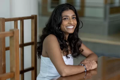 When Aanika Patel ’25 of Needham, Mass.,  will offer this year’s Senior Address at Commencement. On a rainy day, she poses for a portrait in Pettengill’s Perry Atrium.
