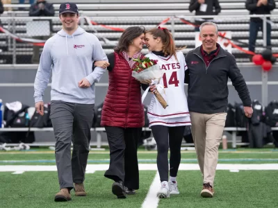 April 5th, 2025 - Garcelon Field The women’s lacrosse team took on the Connecticut College Camels this Saturday for their Senior Day match up. The bobcats came out on top with a final score of 13-11, with Julia Roelofs ’26 scoring a buzzer beater for the game-ending goal. Bates College President Garry Jenkins and his husband were in attendance to cheer on the team and celebrate the seniors.