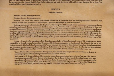 In the 2026 printing of the Maine State Constitution, the first to be printed in 150 years, three sections of Article X that had been redacted in 1876 were restored. From Sept. 21 to Oct. 1, Ladd Library hosted a display of three of the pages with restored language. Photo by Carly Philpott '27 for Bates College