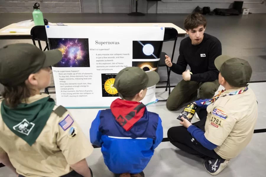 Students from Associate Professor of Physics Aleks Diamond-Stanic’s Intro to Astronomy course held 20 interactive learning activities on topics including constellations, seasons, moon phases, planets and stars, gravity, telescopes, supernova explosions, and black holes.
Caption info for Community Astronomy Night
Mark Diamond-Stanic, 7, of Lewiston jumping
Adam Joseph ’25 of Bloomfield, Conn., and Naomi Lynch ’25 of Farmingdale, Maine, at the rocket jumping station, seeing who can make the rocket go highest: the amount of force is related to how fat the rocket launches and how high it goes. It’s about how gravity works.
Bates students jumping at this station: Zach Van Dusen in blue jacket, Sydney Schuster in purple bandana, Talia Skaistis in black and yellow, and Julia Neumann in green.
Dexter Demers, 9, of Minot with Julia Johnson, Emmy Pike at Poster, Delaney Nwachukwu ‘24
The Electromagnetic Spectrum
Hannah, 8, with brothers David, 6, and Evan, 4 (mother is Michelle Richards of Lewiston)
Afonso, 5, of Lewison. His father is Afonso Ngola (afonsongola@hotmail.com). With sister Rebeca, 18
Teddy Rocque, 7, at moon phases station with Sadie Coleman ’25 and Serena McGrane
Intro to Astronomy, Maddox, 8, of Lewiston
Hula hooping
Daphne Valen ’23 in sweatshirt
Evan Antonakes ’23 amd Lincoln Rybeck ‘25
Boy Scout master Dan Poirier (615-9952) of Troop 1791 in Auburn
Chad, 11, right; Wyatt, 11, center, and Calvin, 11 left