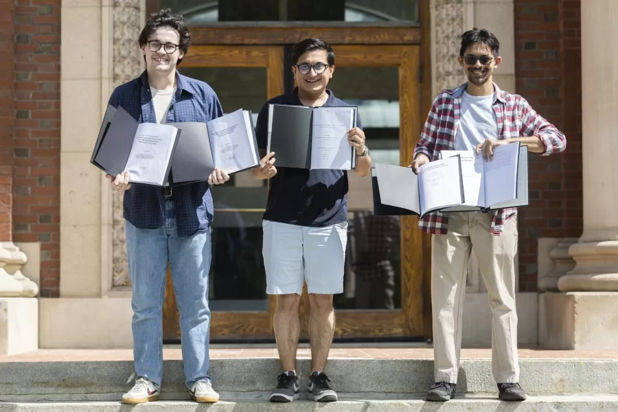 "The best things in life come in threes, like friends, dreams, and memories."
— Mencius
Three seniors, (from left) Brady Chilson of Carlisle, Pa., Kush Sharma of South Burlington, Vt., and Trijit Pico Banerjee of Morristown, N.J., gathered before a group of friends on the steps of Coram Library on Friday, May 12, to bind their senior theses and launch a celebration.
Chilson produced two theses, one in English, another in politics: “Towards a ‘World Elsewhere’: Integrating Frameworks of Queer Theory and Political Representation in Shakespeare’s ‘Coriolanus’” and “The Impact of Electoral Institutions on Urban/Rural Policy Attitudes: Towards a More Holistic Urban-Rural Divide.”
Sharma wrote one honors thesis in theater: “Practicing a Collaborative Directing Style, Ecotheater, and Theater for Social Change with Madeleine George’s ‘Hurricane Diane.’”
Banerjee produced two honors theses, one in English, the other in philosophy: “Encountering Impossibility: George’s Bataille’s Acéphalic Lifework” and “Does the ‘Divine Marquis’ Subordinate? Pornographic Subordination in Literary Fiction.”
Swipe left for additional binding and cork-popping moments.