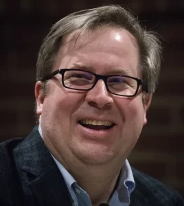 Moderator John Baughman, Associate professor of politics, listens as Matthew Dunalap, Maine Secretary of State, speaks on his work as a member of President Trump's Voter Fraud Commission, which the President disbanded after Dunlap sued the Commission for allegedly violation the Federal Advisory Committee Act while presenting during an event at Muskie Archives on February 28, 2018.