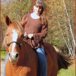 Image of woman riding a horse