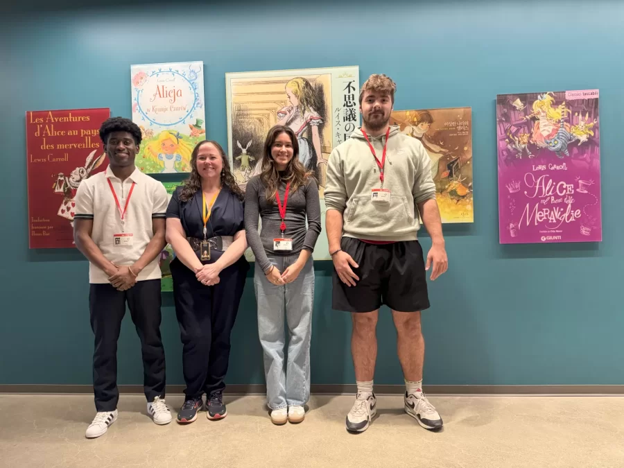 Mo Al-jabry '29, Zach Louvat '28, and Mary Parker '28 shadowing Charis Loveland '02 at Amazon Web Services in April 2025.
