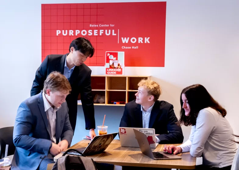 Students at a table with laptops