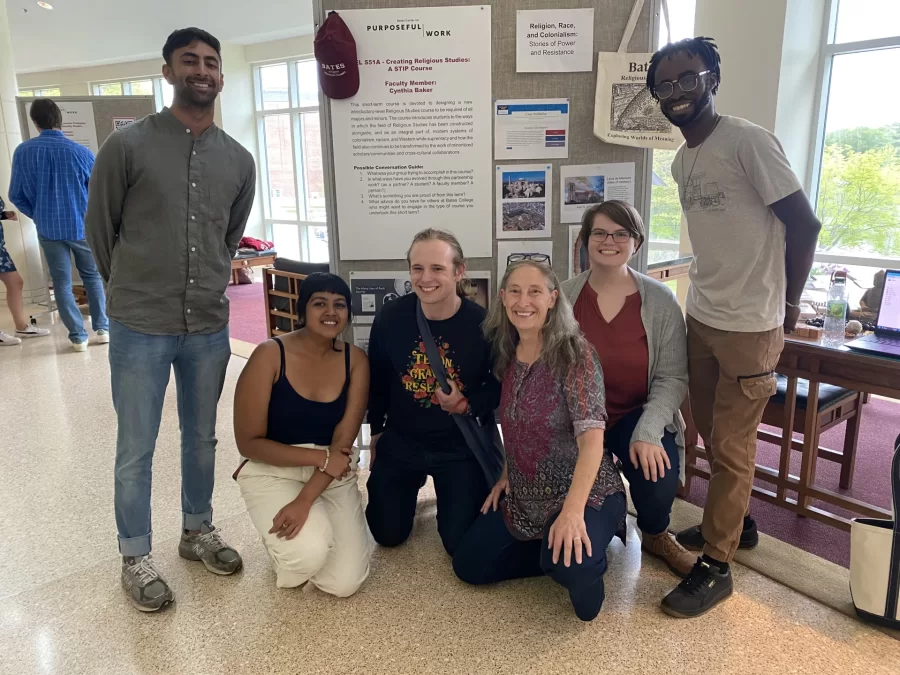 A student-centered course-design team led by Prof. Baker met during Short Term in May 2023 to create a new introductory Religious Studies course that centers race, power, privilege, and colonialism. Here they present their progress at a campus-wide showcase event. From left Rishi Madnani ’23, Khushi Choudhary ’23, Jack Cantor ’23, Prof. Cynthia Baker, Martha Coleman ’23, and Rashad King ’25. Prof. Marcus Bruce (not in photo) also worked closely with the design team and will launch the new course in Winter 2024.