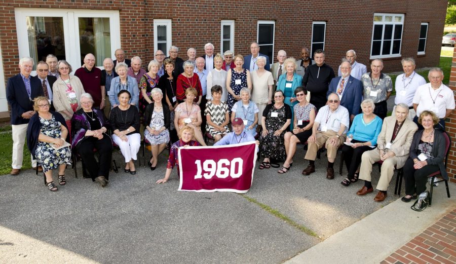 Members of the Class of 1960  pose for a class picture in front of the Benjamin Mays Center.