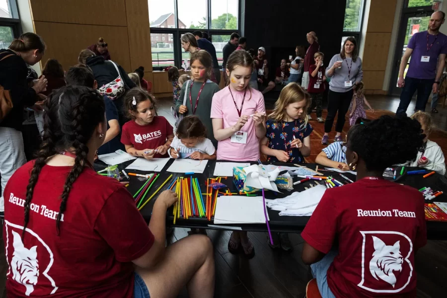 Moments from the Bobcat Adventures for Kids: Face Painting & Crafts event in the Fireplace Lounge during this year’s Reunion on June 7, 2025. (Theophil Syslo | Bates College)