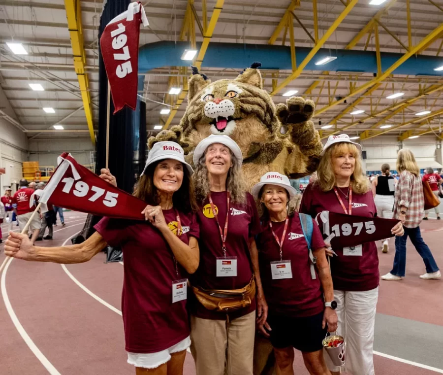  We’re not going to let it rain on our parade. No way. From the Class of 1960 to 2020, a whole bevy of Bates Bobcats got decked out in their best garnet garb — witty T-shirt phrases and all — to march around the Merrill Gymnasium track for the annual #BatesReunion parade. While the rain forced the parade indoors, classmates didn’t let the weather dampen their spirits, processing with plenty of good cheer, big smiles, and Bates pride.