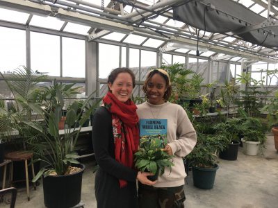 Plot leaders Katherine Gaillard '19 and Isa Moise '19 in the Carnegie greenhouse at a weekly Wednesday afternoon meeting. Having just finished planting onion seeds, they organized Garden Club members on a daily watering schedule to ensure the plants would be ready to transplant later this spring.
