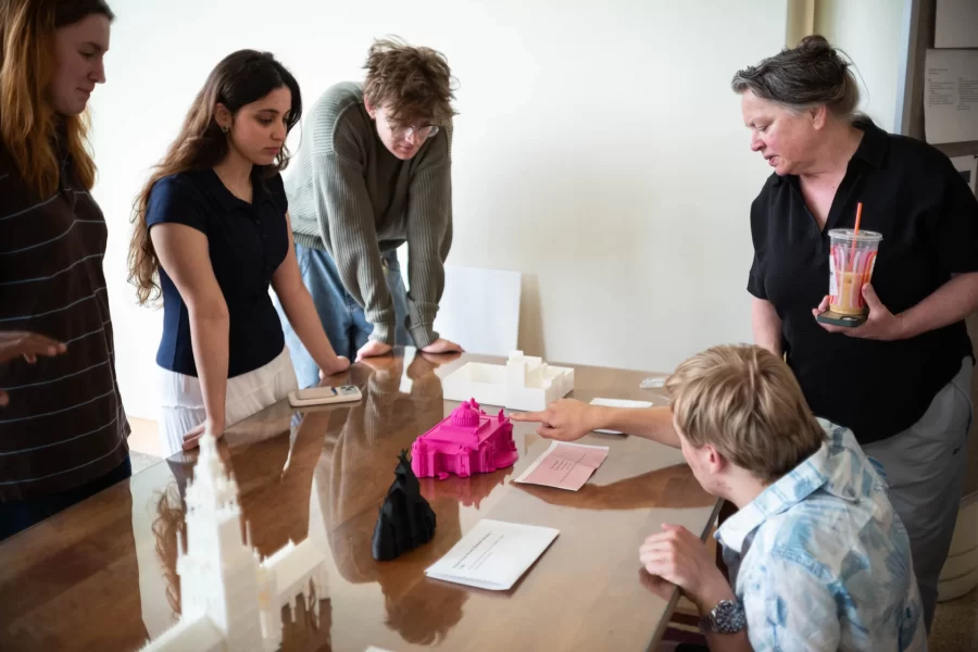 Visitors examining 3D models