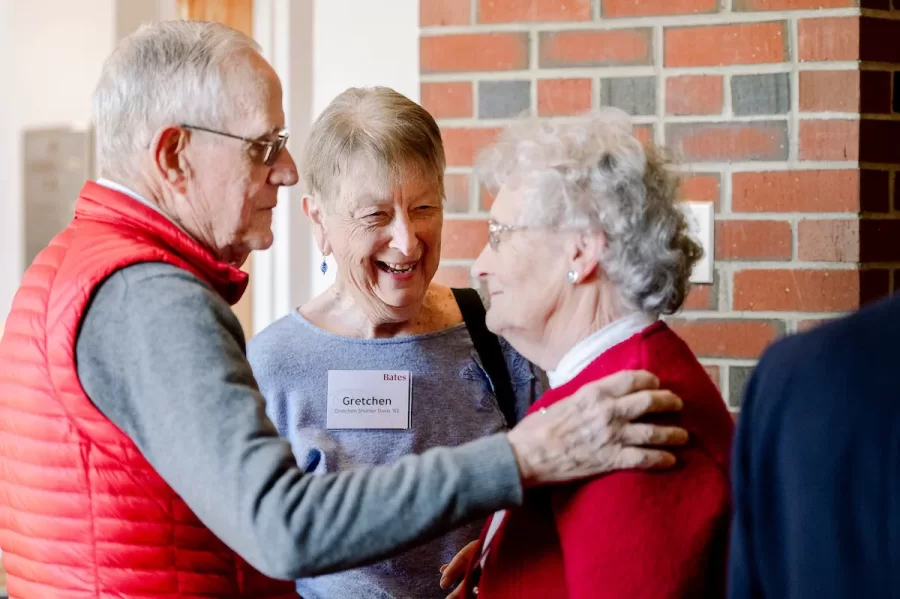 Charles G. Davis '61, left, and his wife Gretchen Shorter Davis '61 chat with fellow alumni Mary Morton Cowan '61, during the first annual Phillips Society luncheon on April 4, 2025 at the Benjamin Mays Center. (Brittney Lohmiller for Bates College)