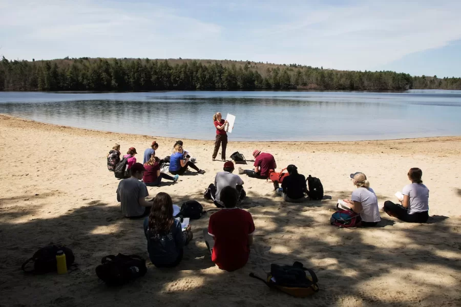 Alice Doughty lectures from Range Pond State Park during her Lost Maine Beaches class on May 7, 2018. Students hiked trails, observed glacial landforms, took samples as well as sieve and build a delta on the beach.