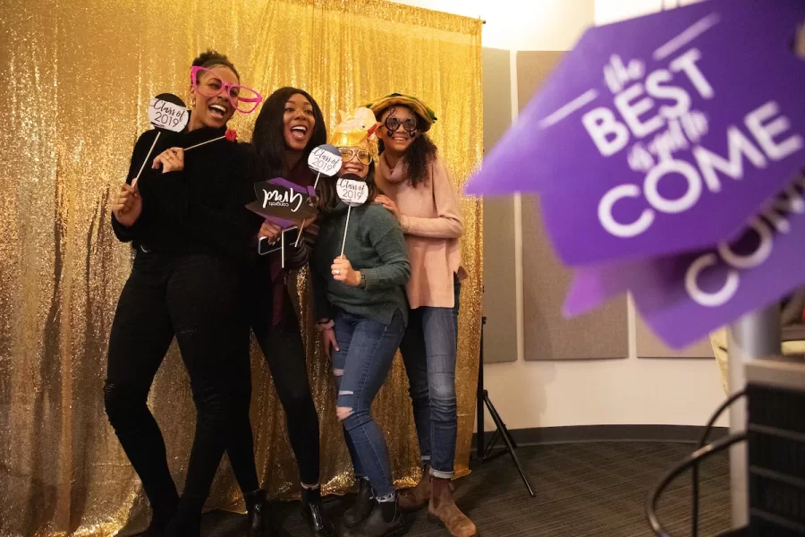 Emily Bowen '19 of Pasadena, Calif., Afia Sekyere '19 of Tampa, Florida, Yeymi Rivas '19 of Richmond Calif., and Kayla Jackson '19 of Metuchen, N.J., pose for a portrait during the annual OIE Banquet: A Royal Affair, in Memorial Commons on April 8, 2019.